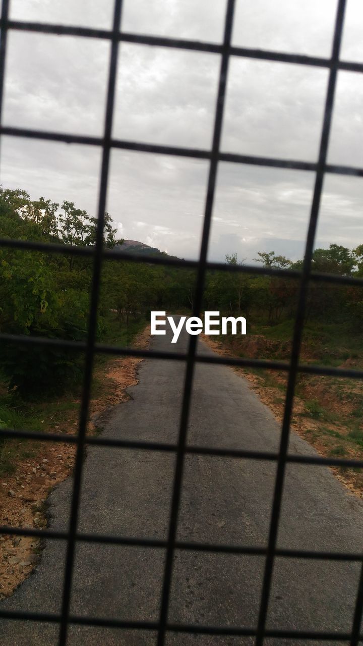 VIEW OF CLOUDY SKY OVER THE ROAD