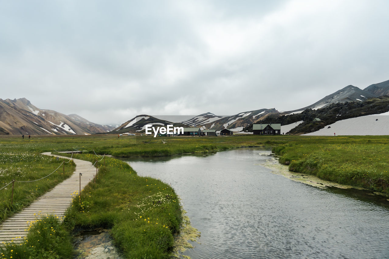 Icelandic landscape of landmannalaugar with camping site and huts for hikers and adventures