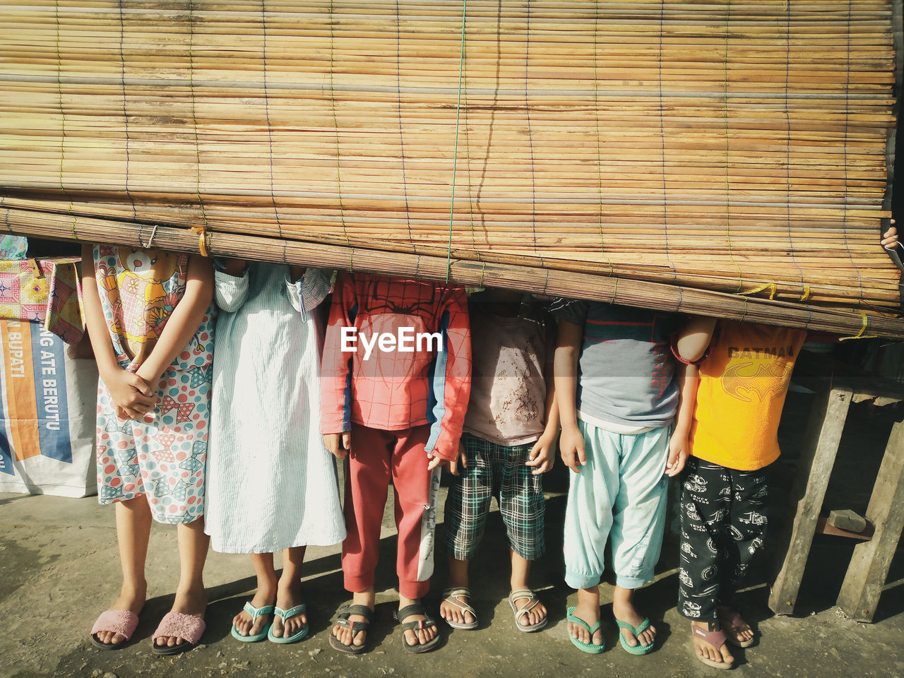 LOW SECTION OF WOMEN STANDING AT MARKET STALL