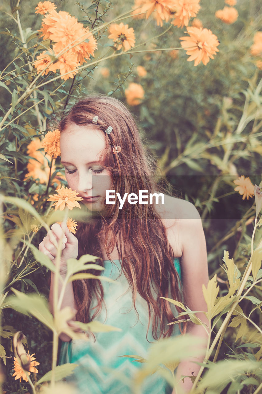 Portrait of young woman outdoors