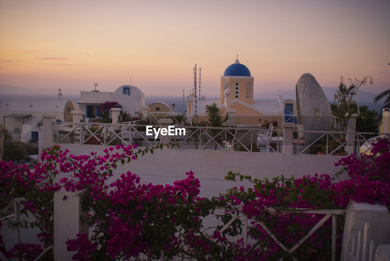 VIEW OF BUILDINGS AT SUNSET