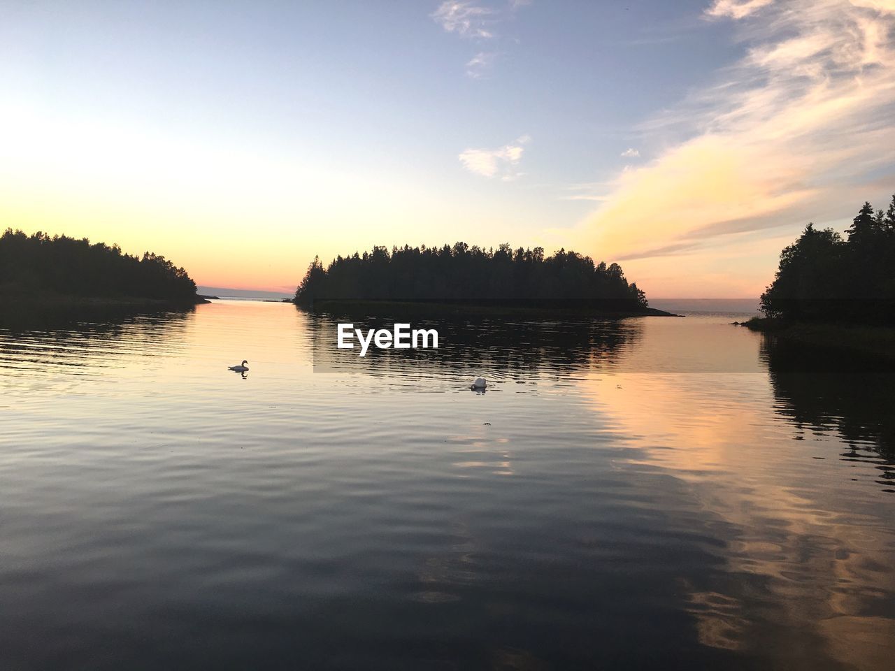 VIEW OF LAKE AGAINST SKY DURING SUNSET