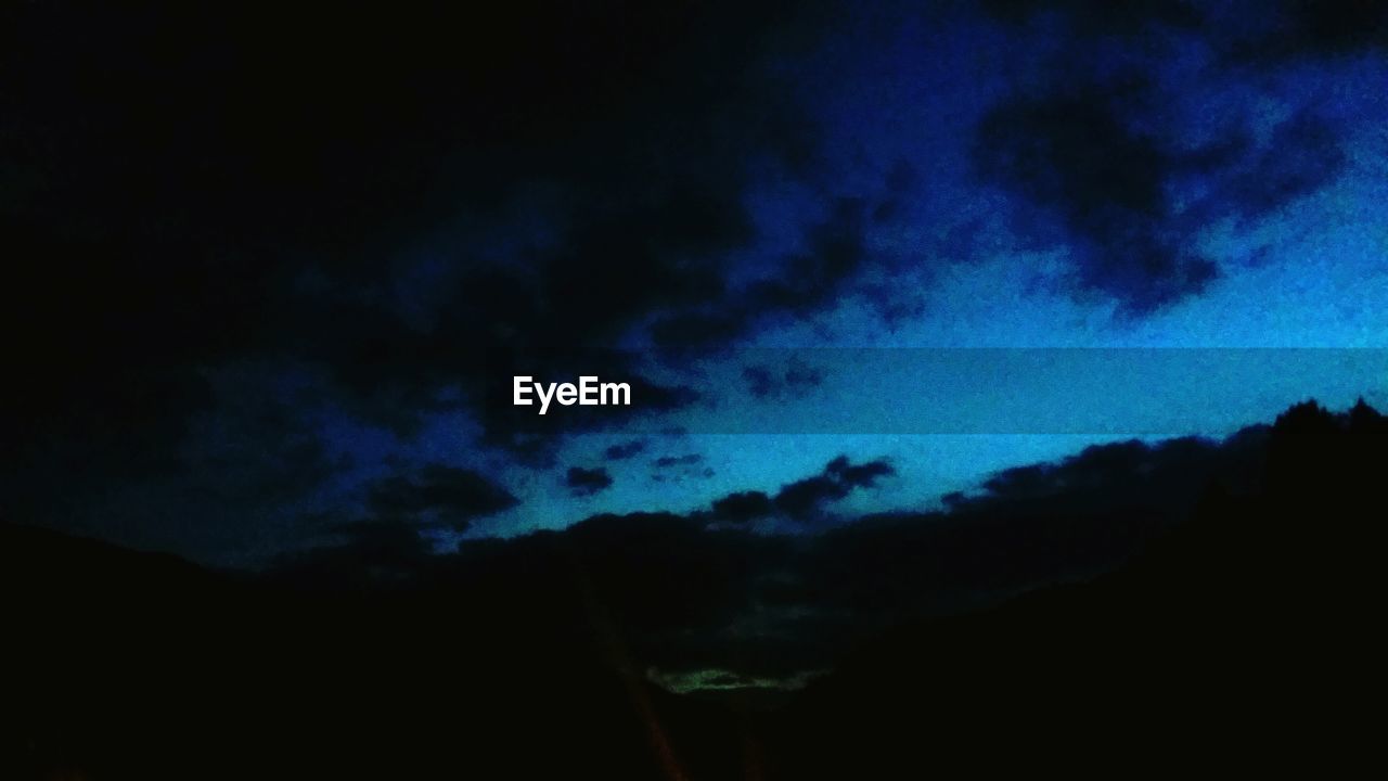 LOW ANGLE VIEW OF BLUE SKY AT NIGHT