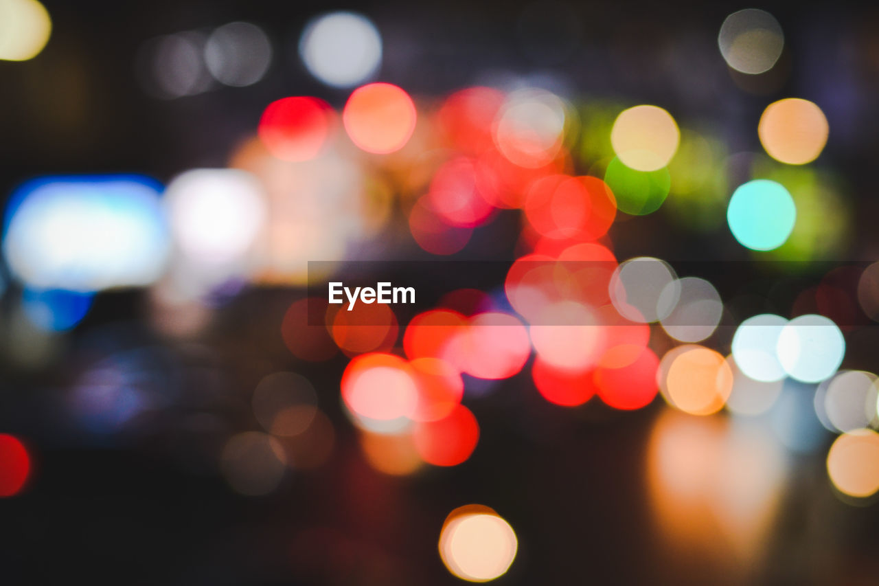 Defocused image of illuminated traffic cars at night