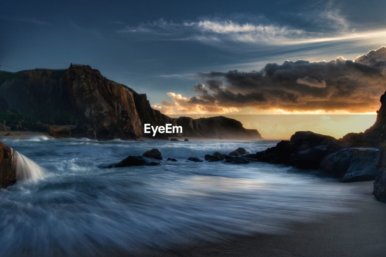 Scenic view of sea against sky during sunset