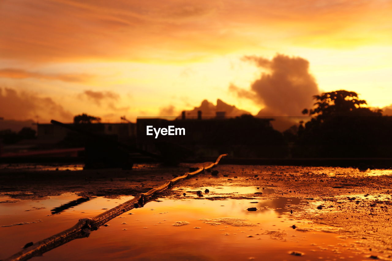 SCENIC VIEW OF SILHOUETTE LAND DURING SUNSET