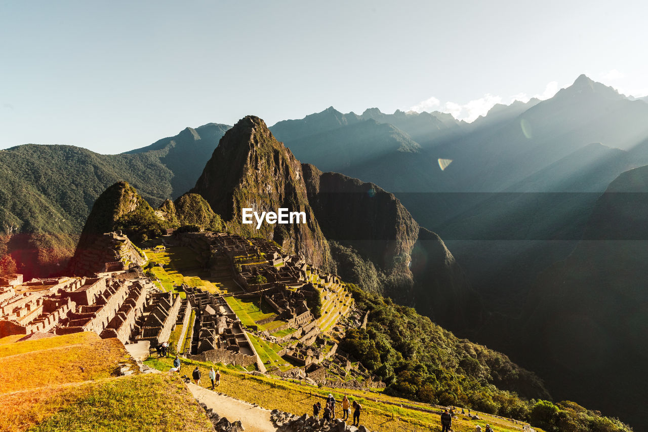 Machu picchu old inca ruins at sunrise in peru