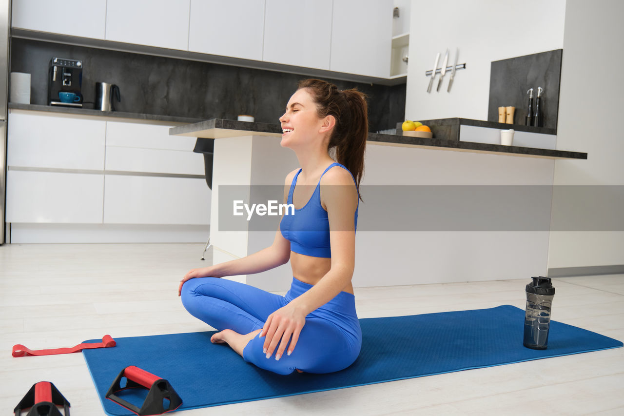 portrait of woman exercising in gym