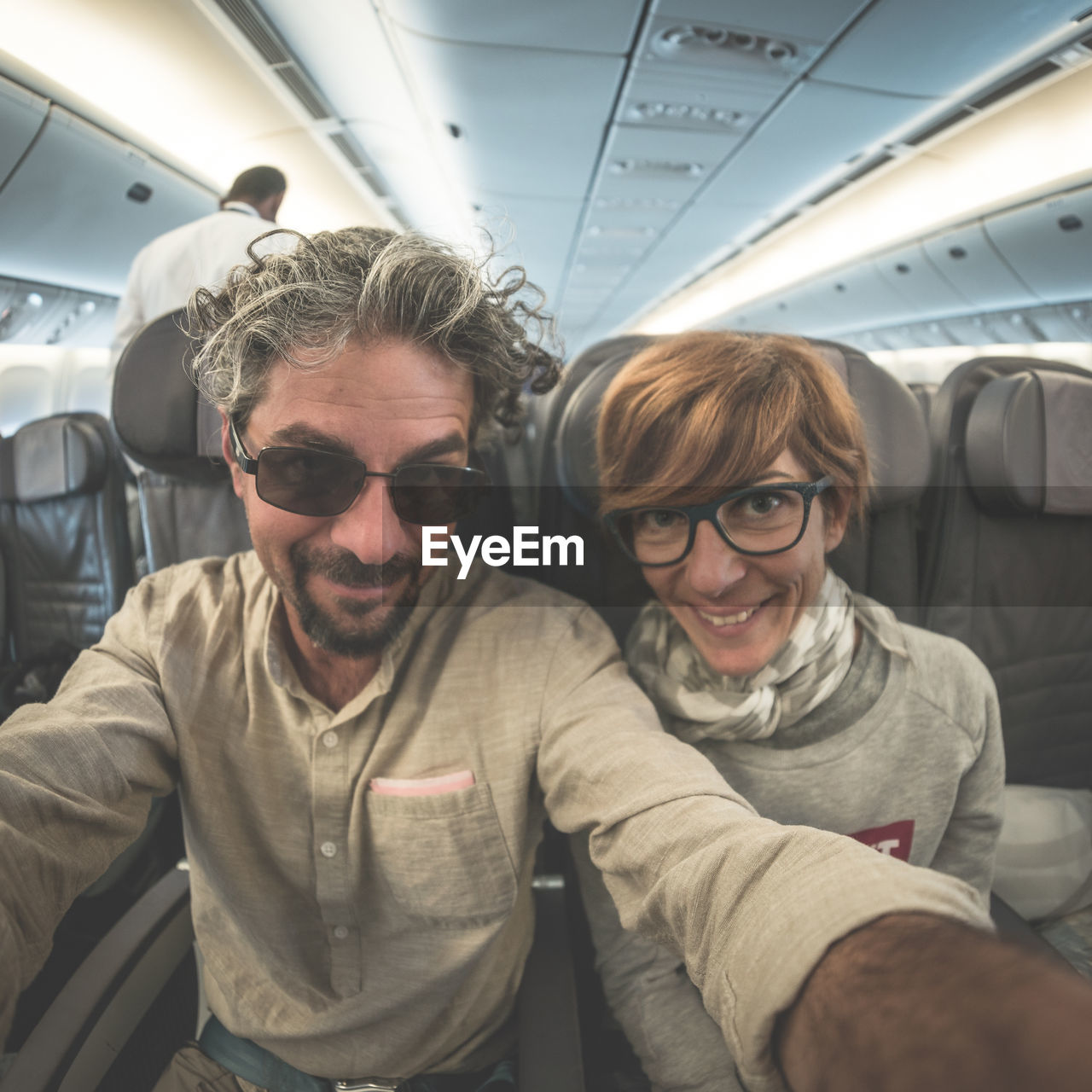 Couple sitting in airplane