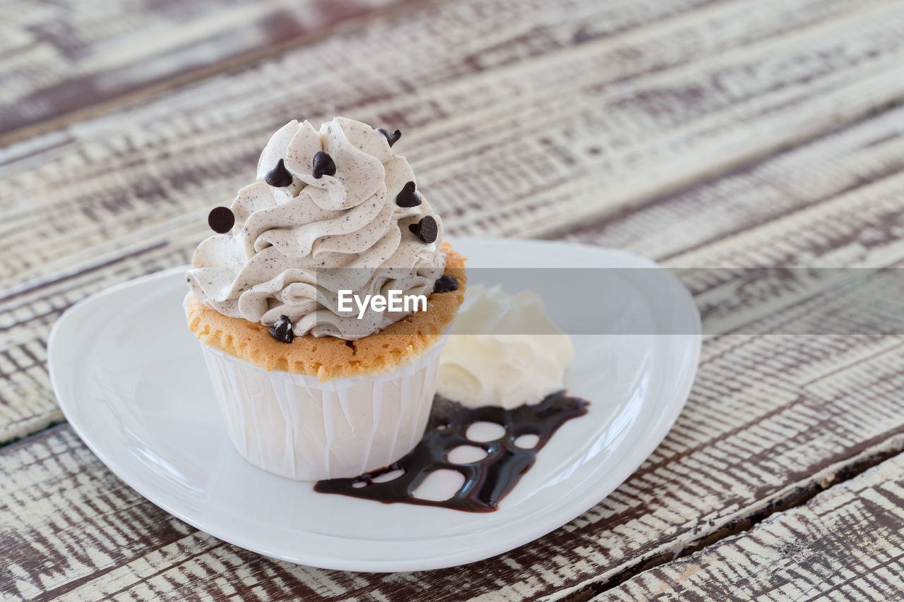 Close-up of cupcake served in plate on table