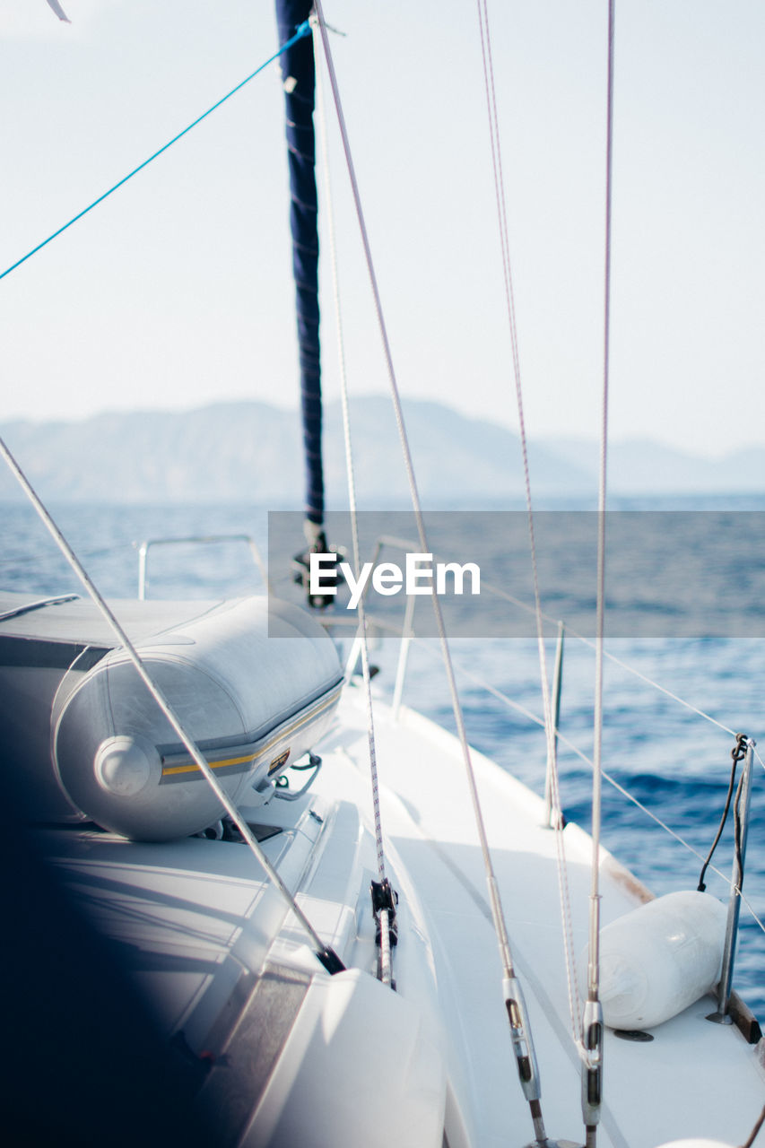 Boat sailing on sea against sky