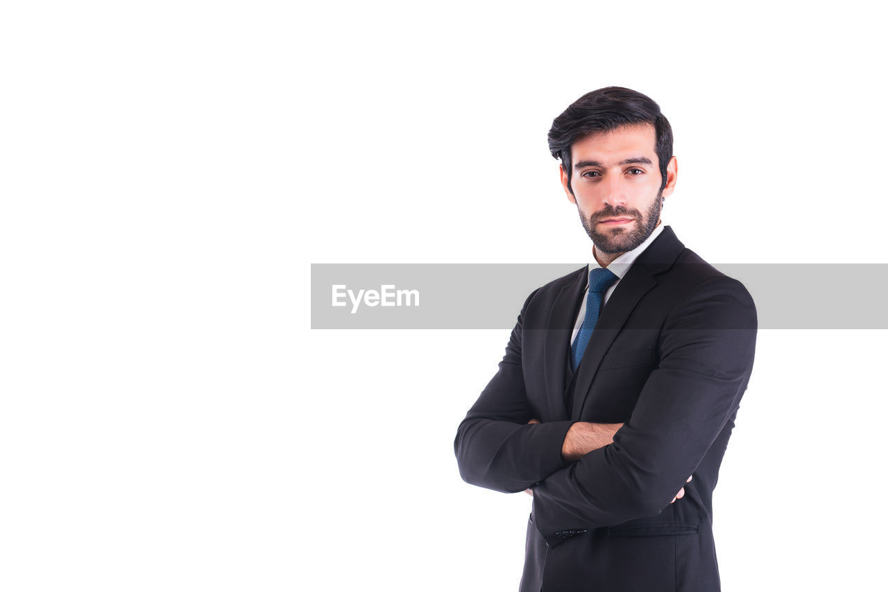 business, formal wear, businessman, men, adult, one person, portrait, white background, copy space, corporate business, tuxedo, outerwear, studio shot, indoors, standing, clothing, cut out, white-collar worker, looking at camera, business finance and industry, professional occupation, young adult, occupation, waist up, finger, person, beard, looking, blazer, front view, serious, arms crossed, full suit, facial hair, smiling, sleeve, menswear