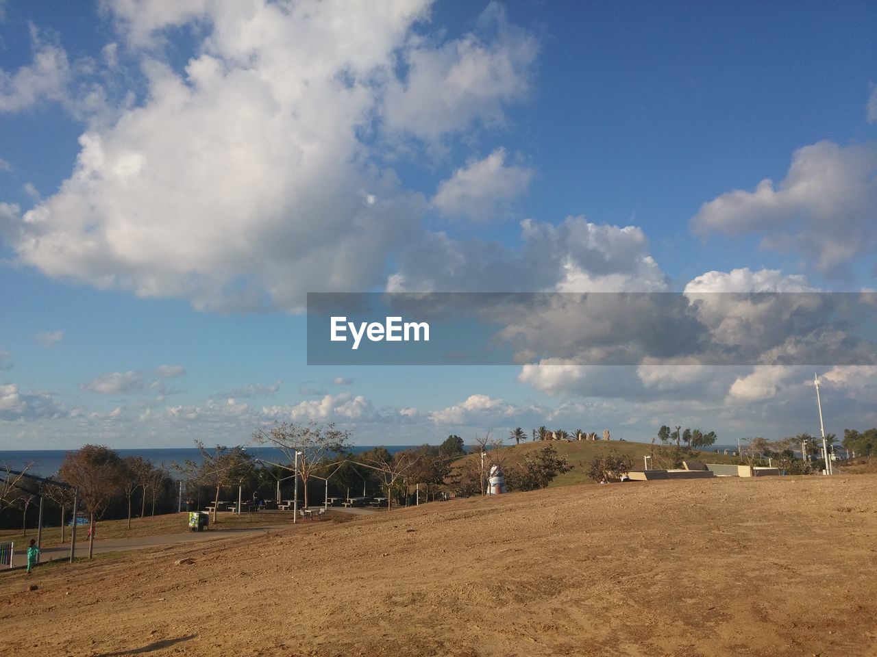 PANORAMIC VIEW OF PEOPLE ON BEACH