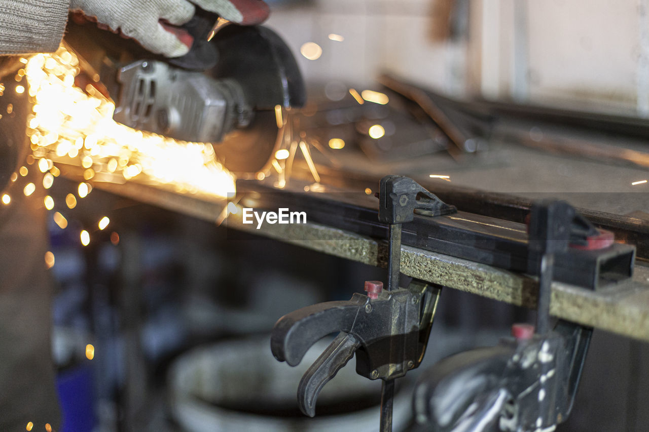 CLOSE-UP OF MACHINE PART IN ILLUMINATED KITCHEN