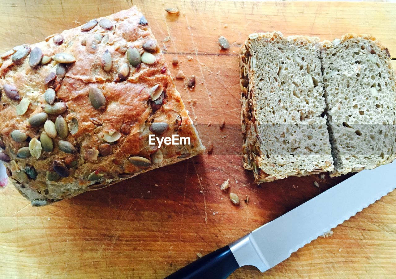 High angle view of bread slices and knife on table