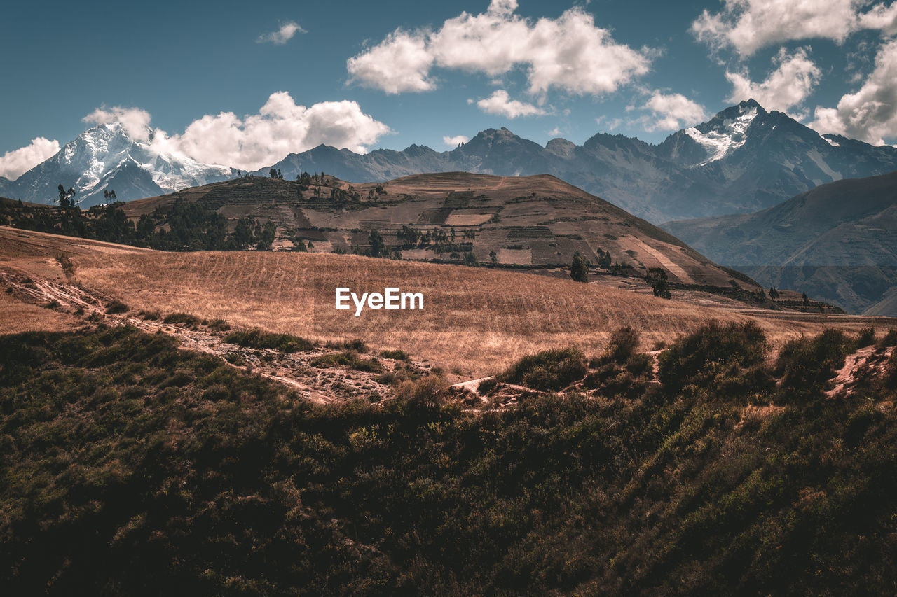 Scenic view of landscape and mountains against sky