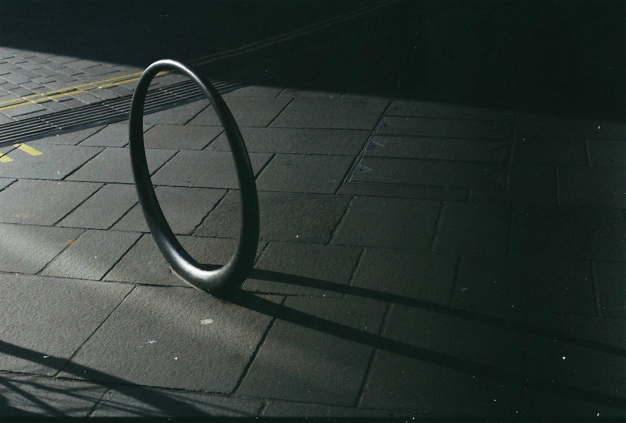 Close-up of metallic ring at bicycle rack