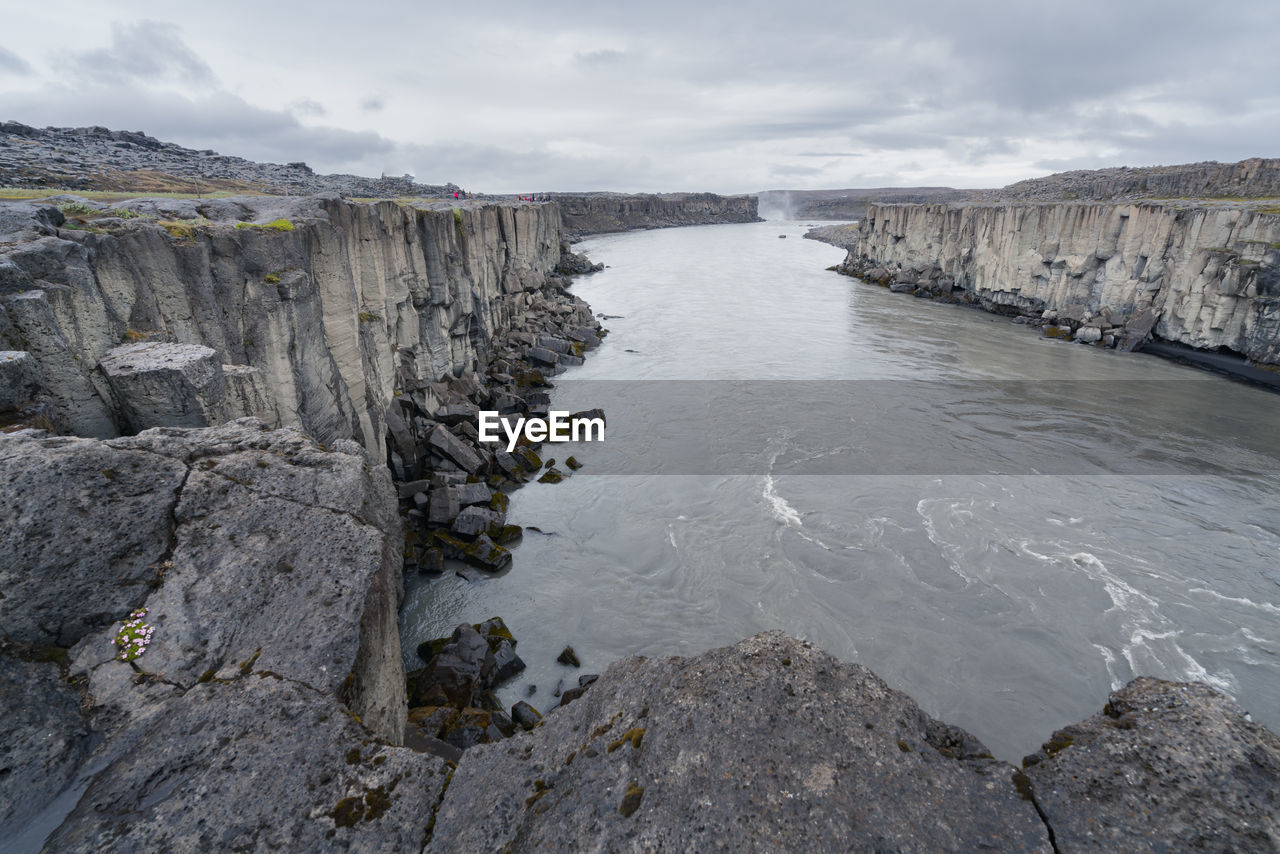 Jokulsa a fjollum river flowing between basalt cliffs near selfoss and dettifoss waterfalls. 