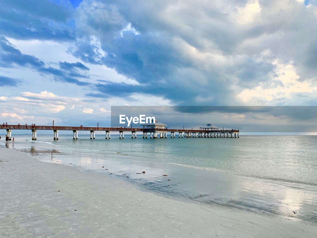 Pier over sea against sky