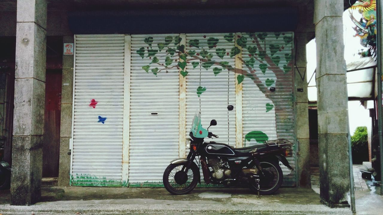 Motorcycle parked in front of store