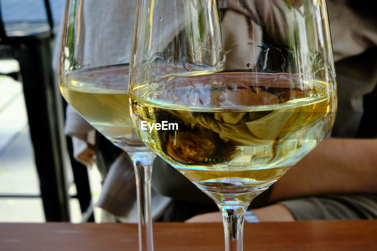 Close-up of wine in glass on table