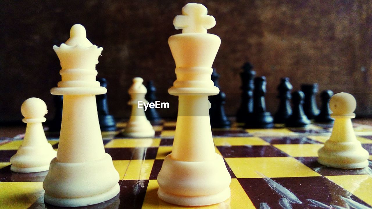 Close-up of chess pieces on board