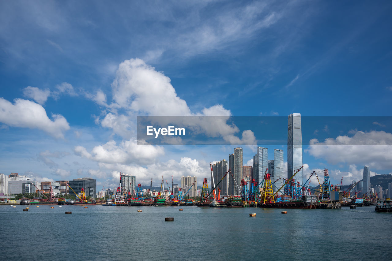 PANORAMIC VIEW OF SEA AND HARBOR AGAINST SKY