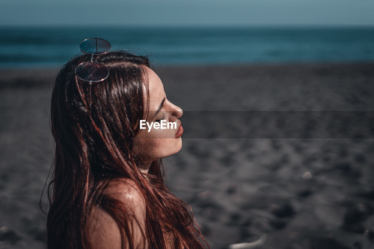 Woman looking at sea shore