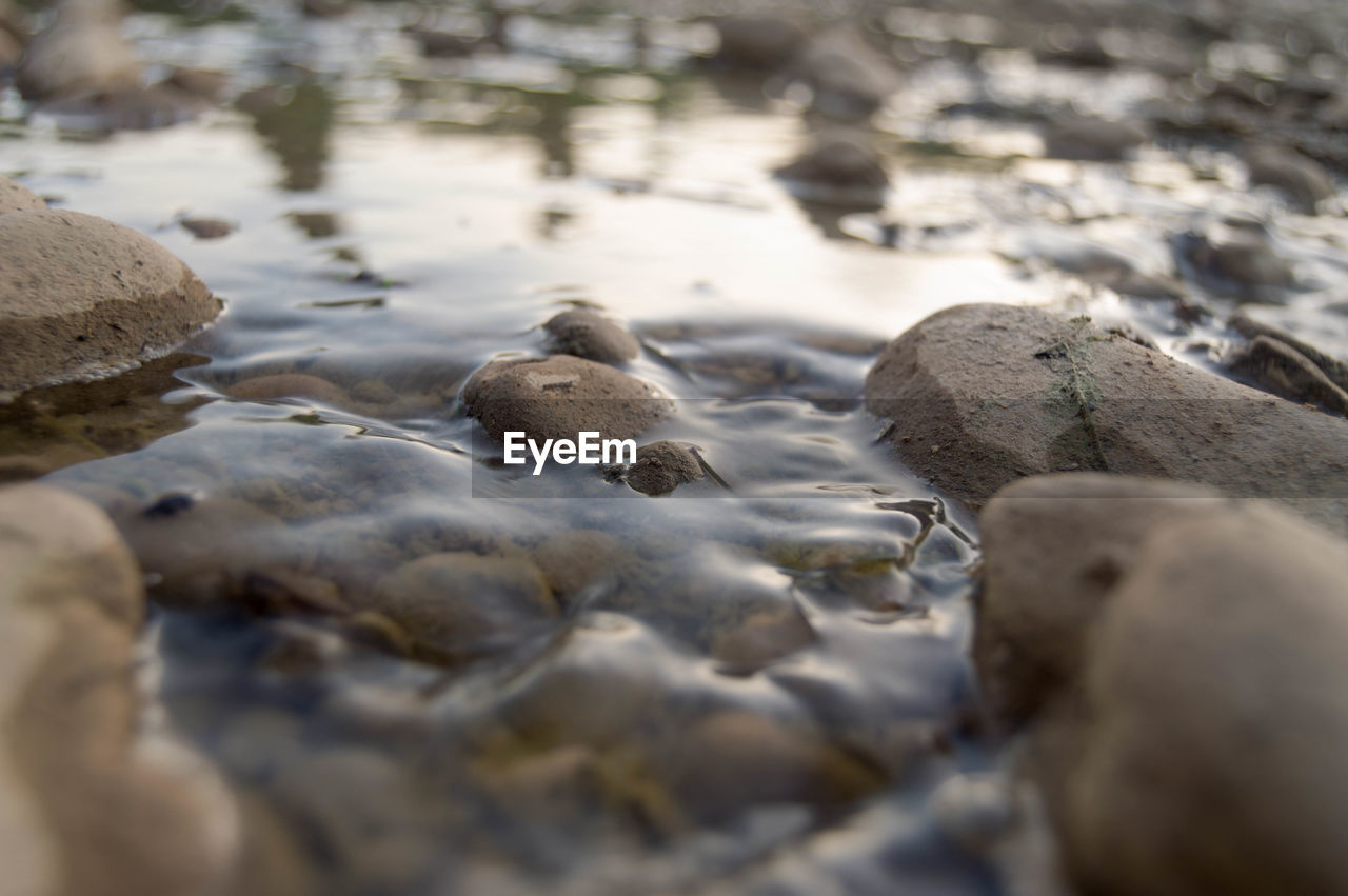 Close-up of stones on beach