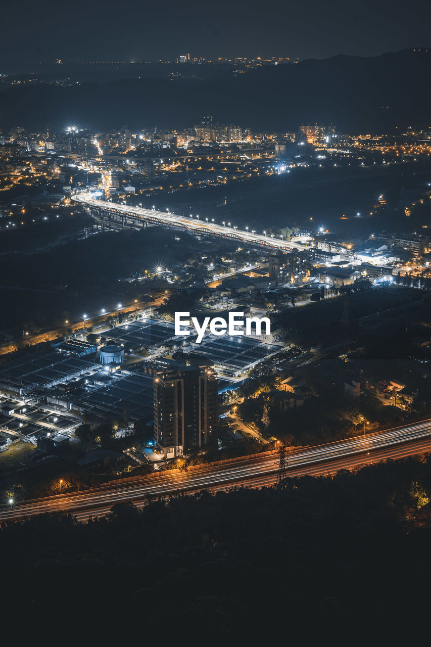 High angle view of illuminated cityscape at night