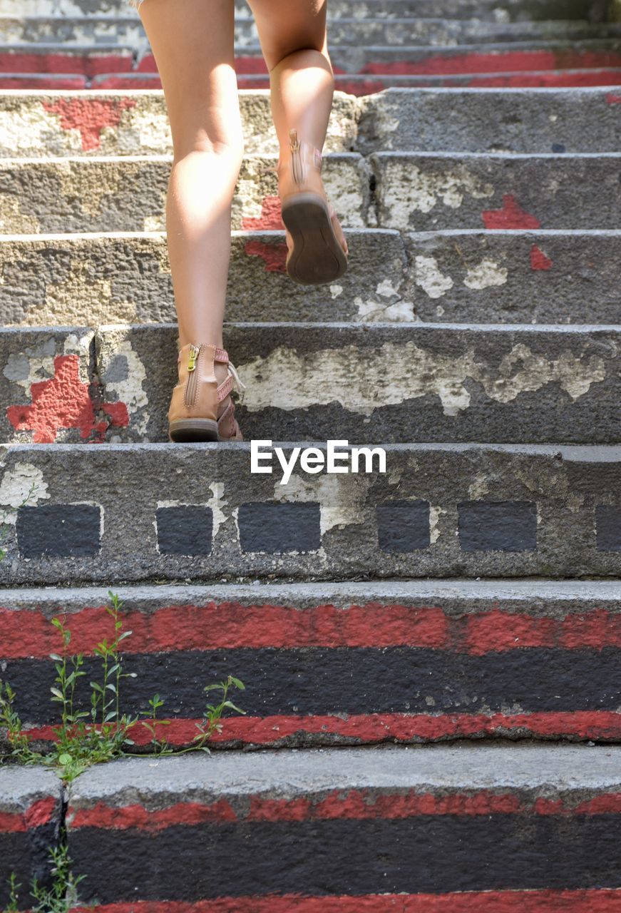Girl climbing some stairs