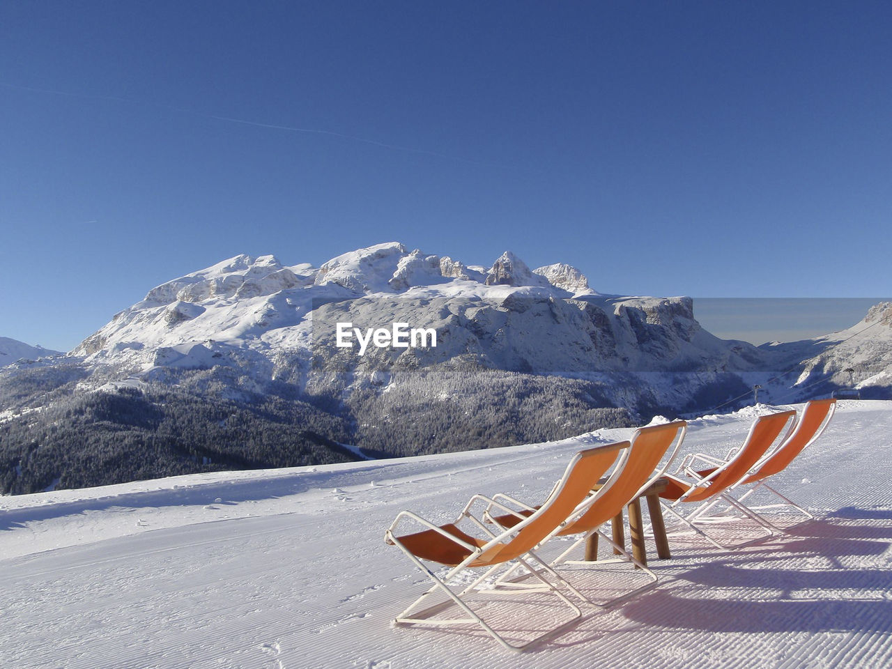 Chairs on a ski run in the alps
