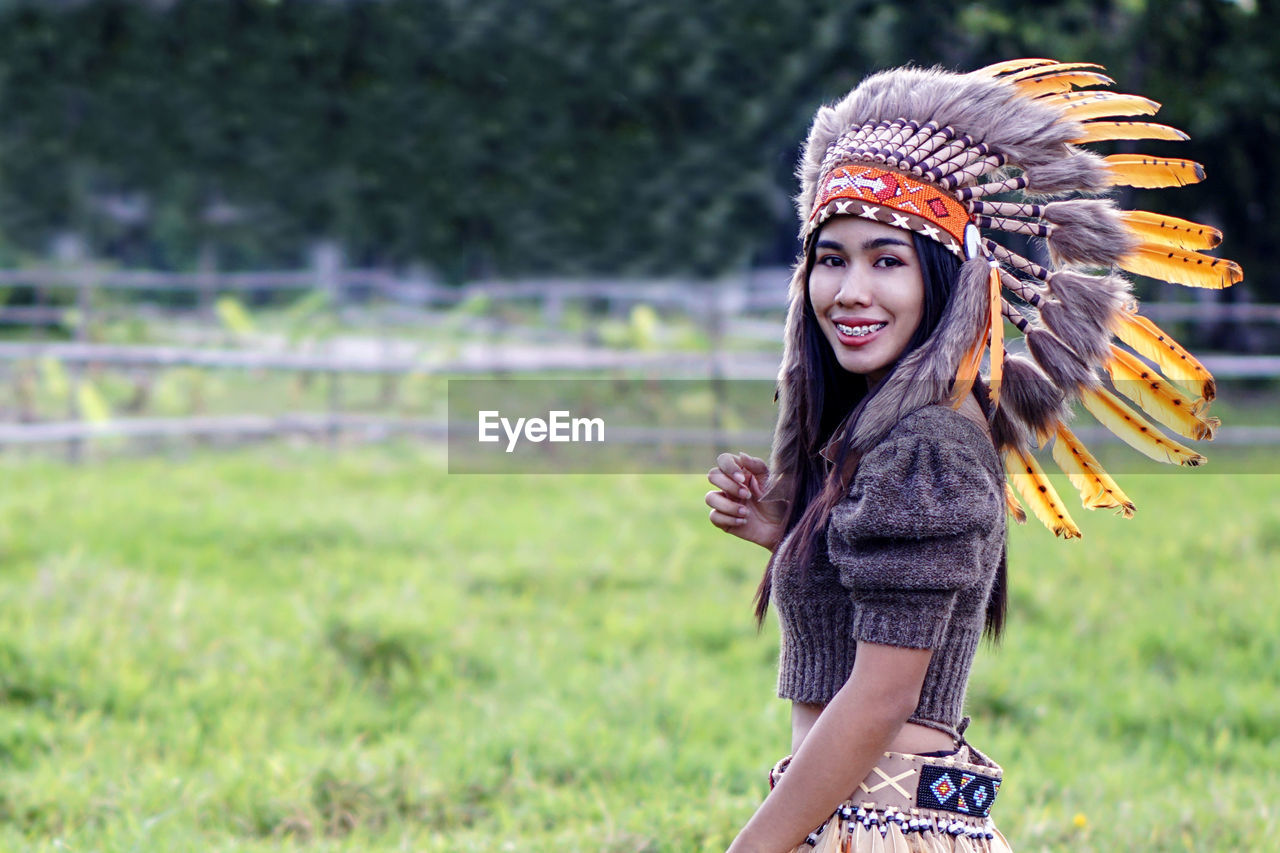 Woman in tribal dress and nature