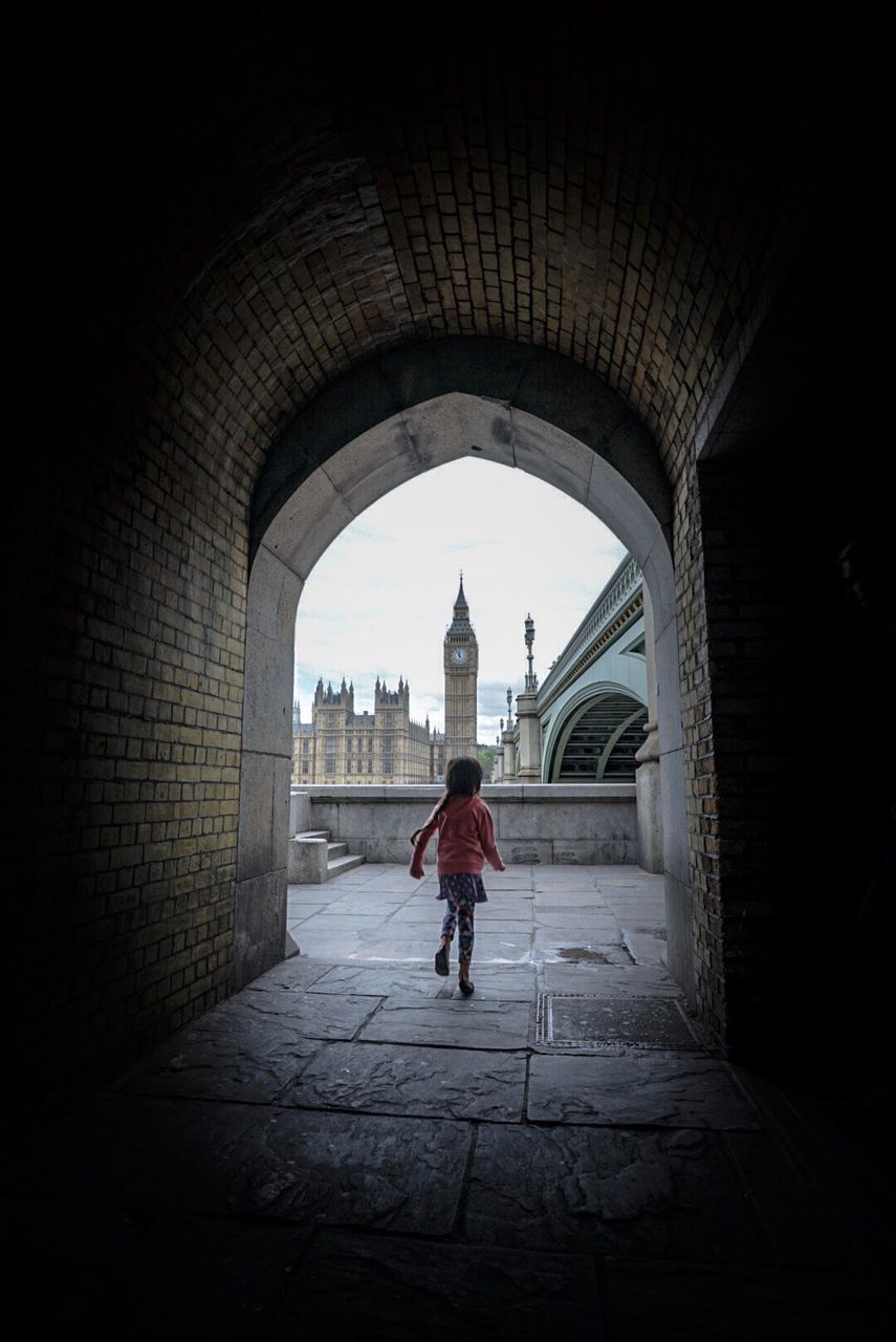 WOMAN WALKING IN A CITY