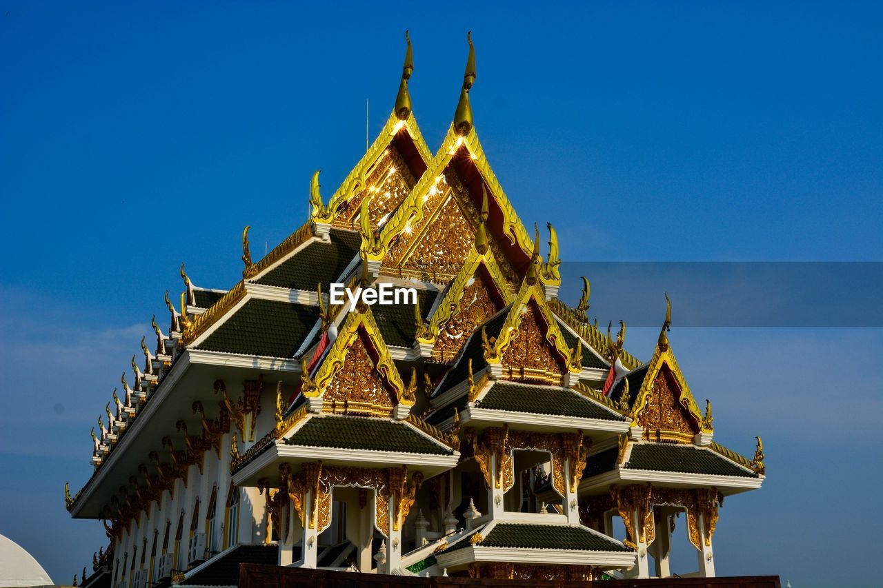 LOW ANGLE VIEW OF TEMPLE AGAINST BLUE SKY