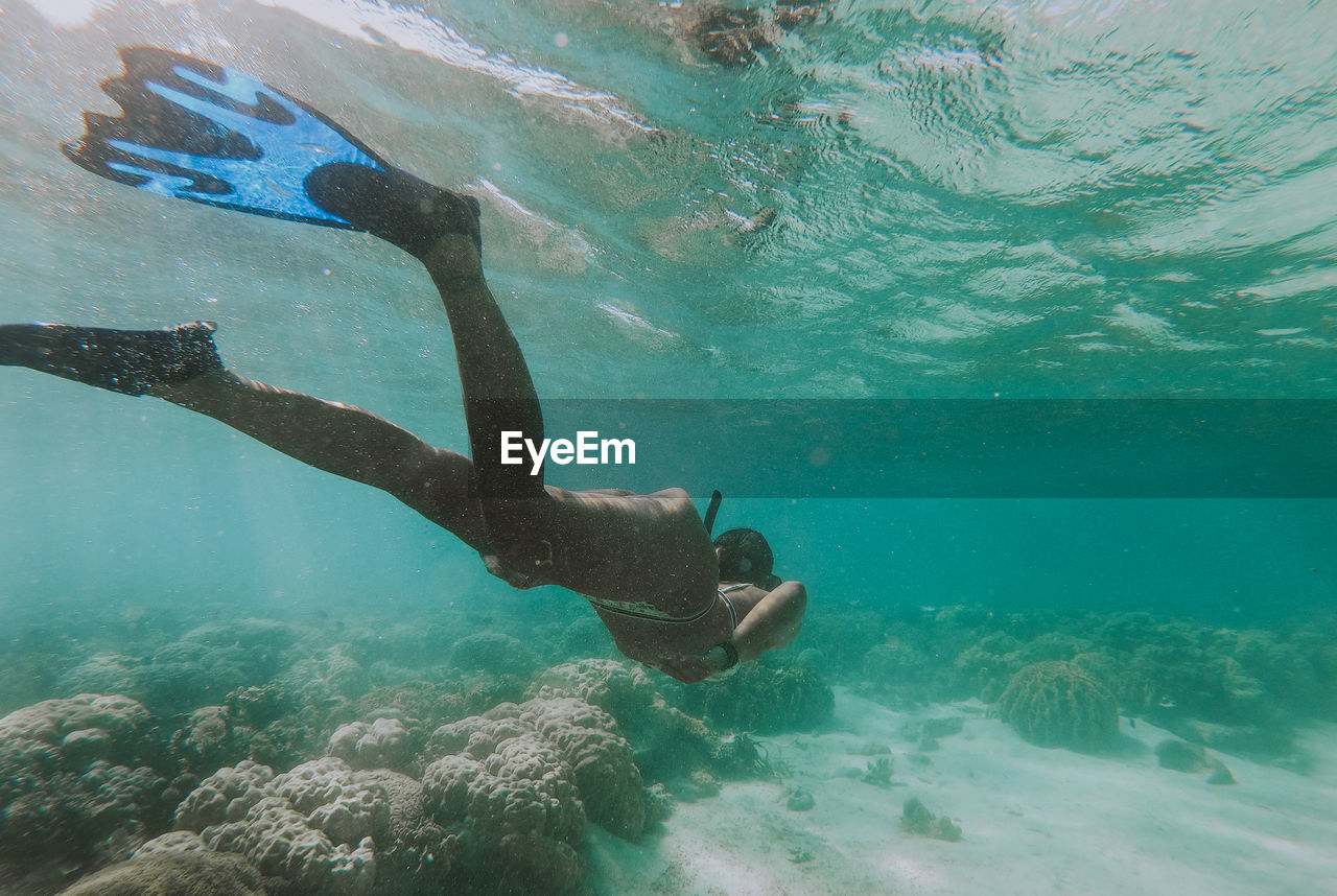 Woman swimming in sea