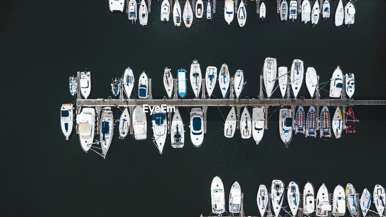 Aerial view of boats moored at harbor