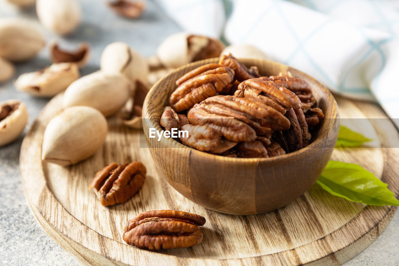 food and drink, food, healthy eating, wellbeing, freshness, indoors, produce, studio shot, nuts & seeds, nut, no people, ingredient, nut - food, spice, close-up, still life, wood, fruit, snack, bowl, dried food