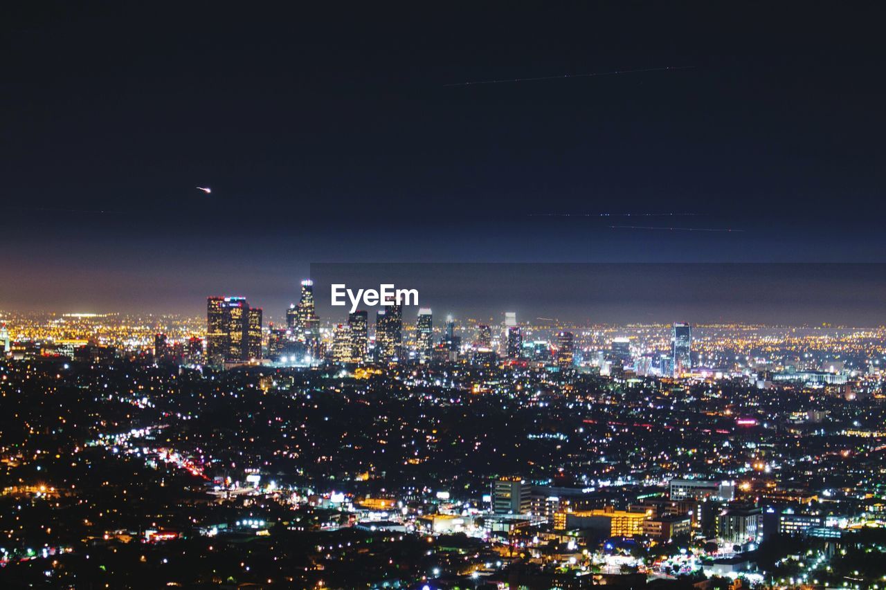 Aerial shot of illuminated cityscape
