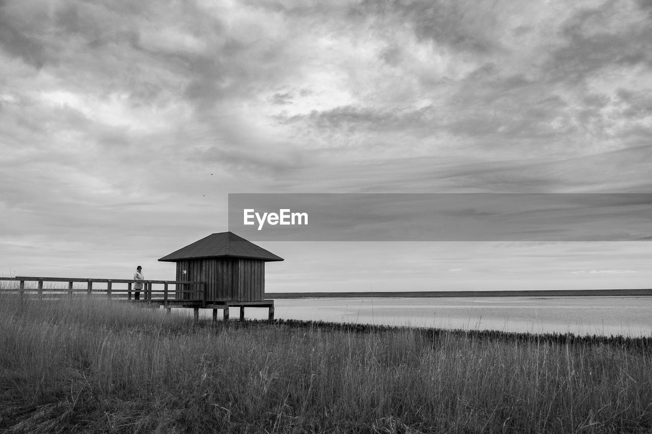 LIFEGUARD HUT ON SHORE AGAINST SKY