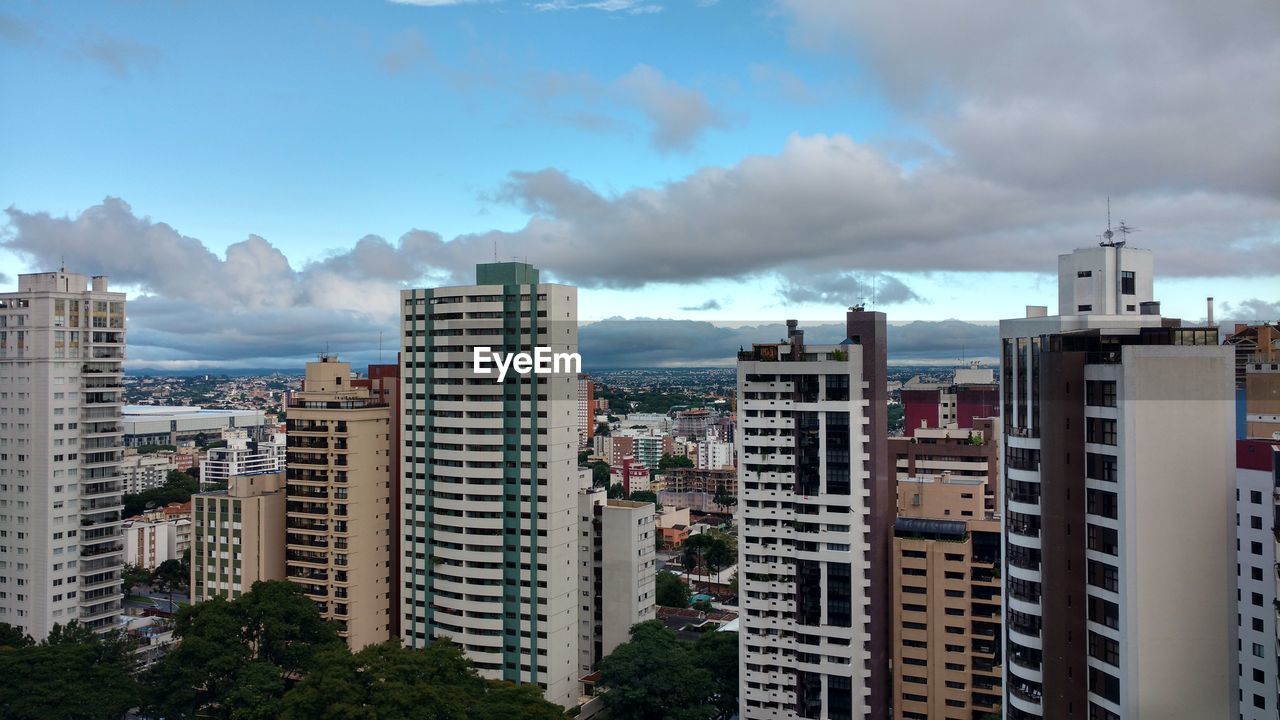 Buildings in city against sky