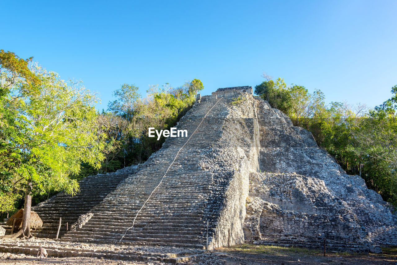 Low angle view of coba pyramid against clear sky