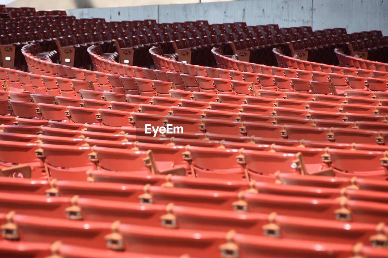 View of red chairs in stadium