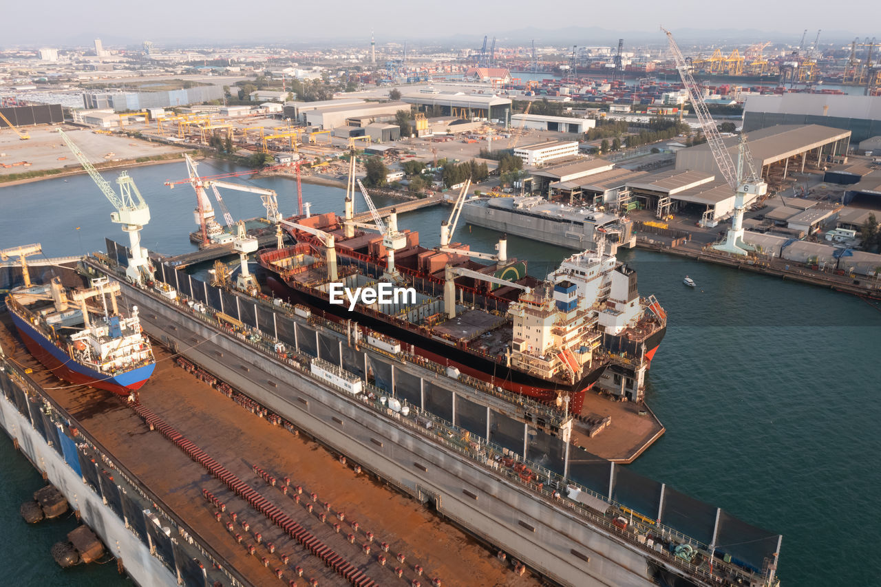 Shipyard and maintenance repair in sea and factory zonne background aerial view