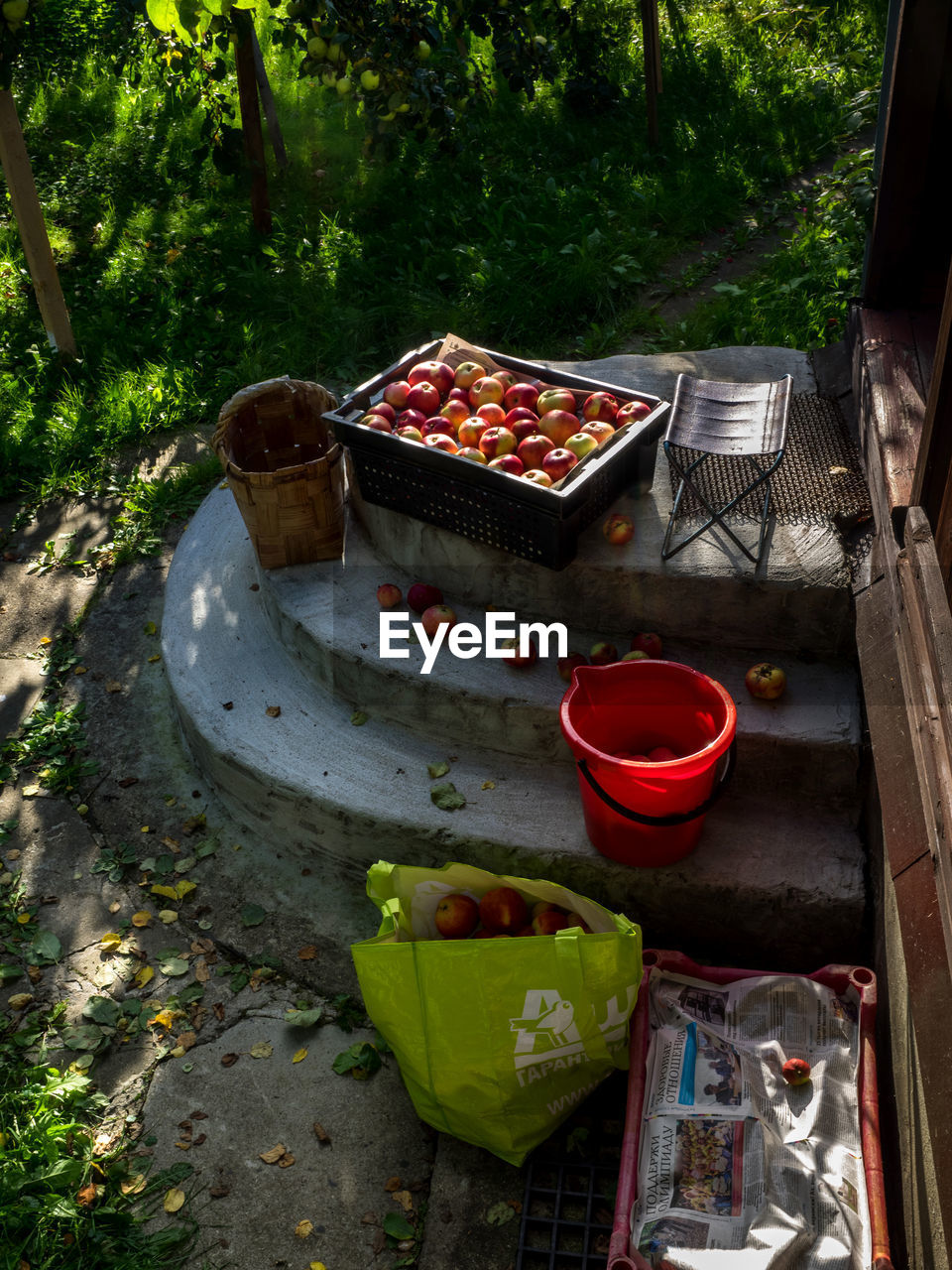 CLOSE-UP OF RED WINE ON TABLE IN YARD