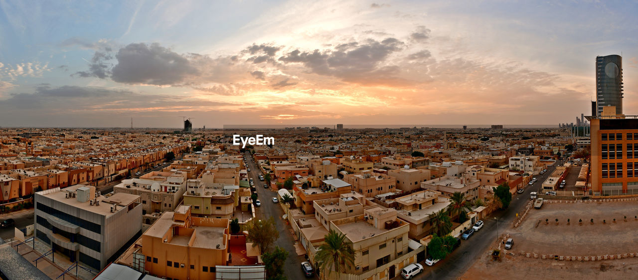 High angle shot of townscape against sky during sunset