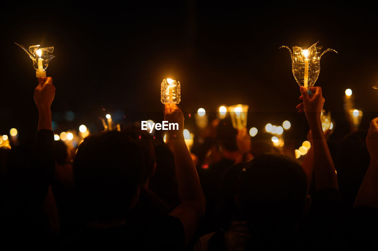 People hand holding candle for pray