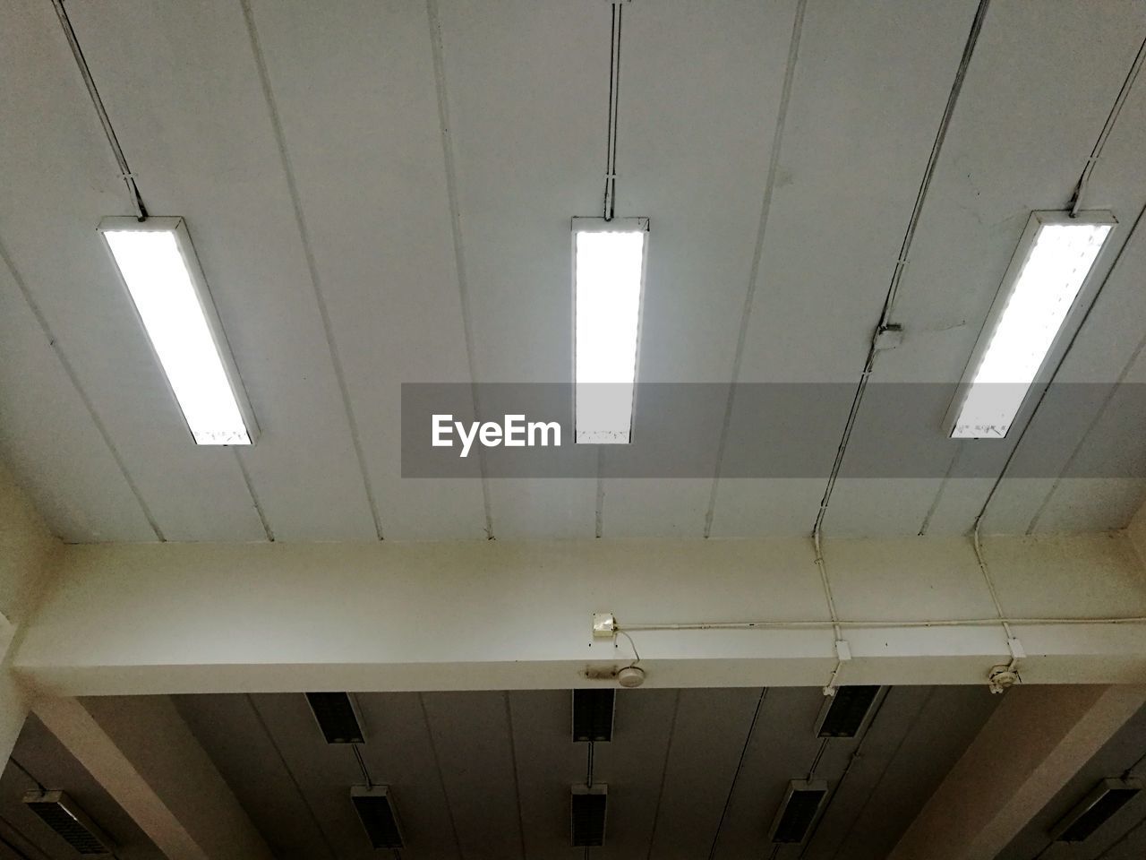 LOW ANGLE VIEW OF ILLUMINATED LIGHTING EQUIPMENT