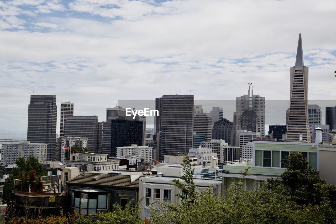 architecture, building exterior, city, built structure, skyline, building, urban area, office building exterior, skyscraper, sky, metropolitan area, cityscape, landscape, urban skyline, downtown, residential district, tower block, metropolis, cloud, nature, downtown district, office, no people, residential area, horizon, landmark, city life, travel destinations, outdoors, tower, high angle view, day, neighbourhood, travel, plant, development