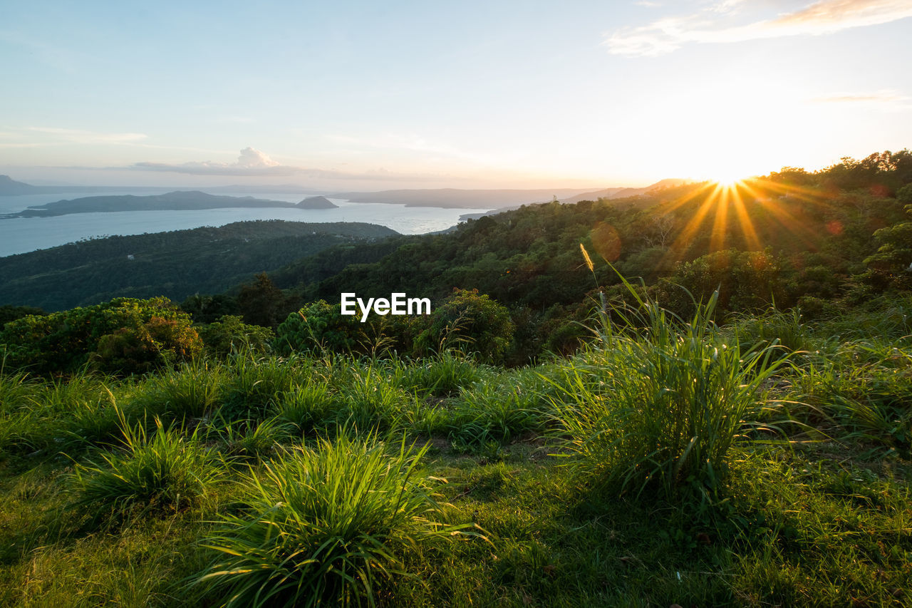 Scenic view of landscape against sky during sunset